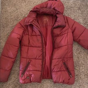 A dark red puffy jacket from Switzerland